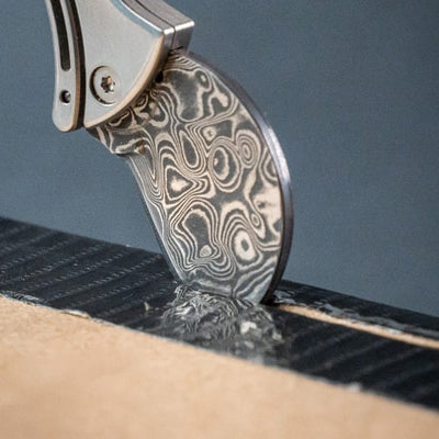 Compacte flesopener van titanium & EDC-snijder