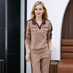 Afbeelding in Gallery-weergave laden, Tweedelig set bestaande uit een broek met V-hals, lange mouwen en wijde pijpen
