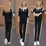 Afbeelding in Gallery-weergave laden, Tweedelig set bestaande uit een broek met V-hals, lange mouwen en wijde pijpen
