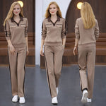 Afbeelding in Gallery-weergave laden, Tweedelig set bestaande uit een broek met V-hals, lange mouwen en wijde pijpen
