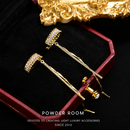 Minimalistische ear cuff met strasssteentjes en kwastje