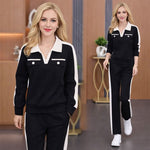 Afbeelding in Gallery-weergave laden, Tweedelig set bestaande uit een broek met V-hals, lange mouwen en wijde pijpen
